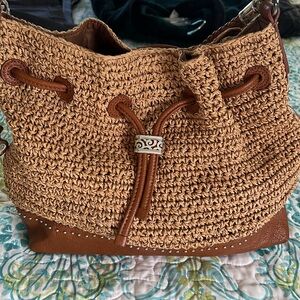 Brighton Designer Handbag with a drawstring closure.EUC.Straw collection